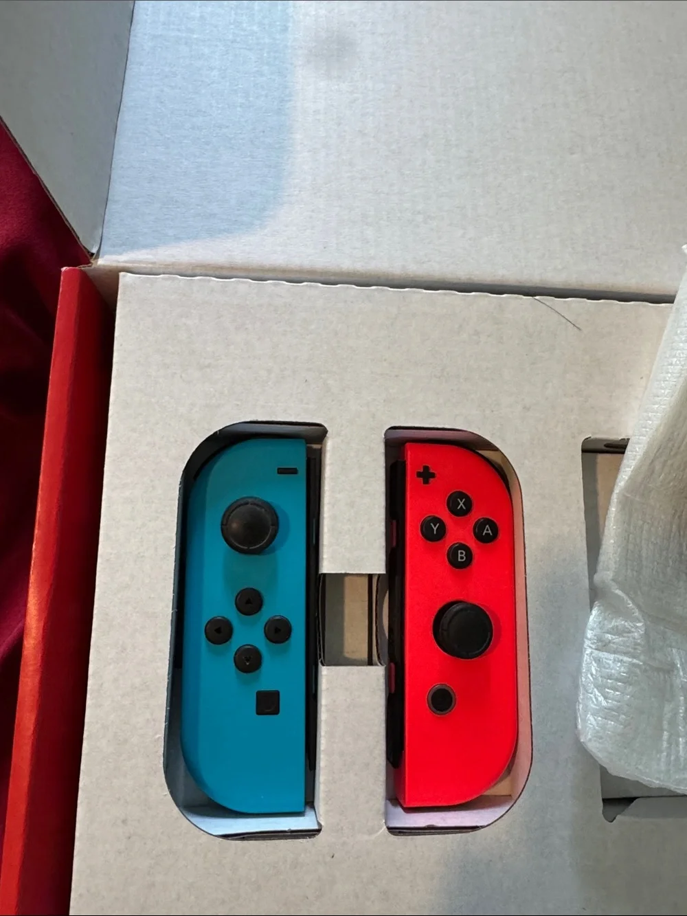 Nintendo Switch with Neon Red and Neon Blue Joy-Con